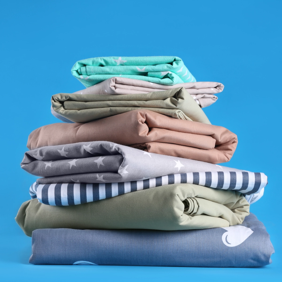 Stacked Bedding On Blue 1200X1200